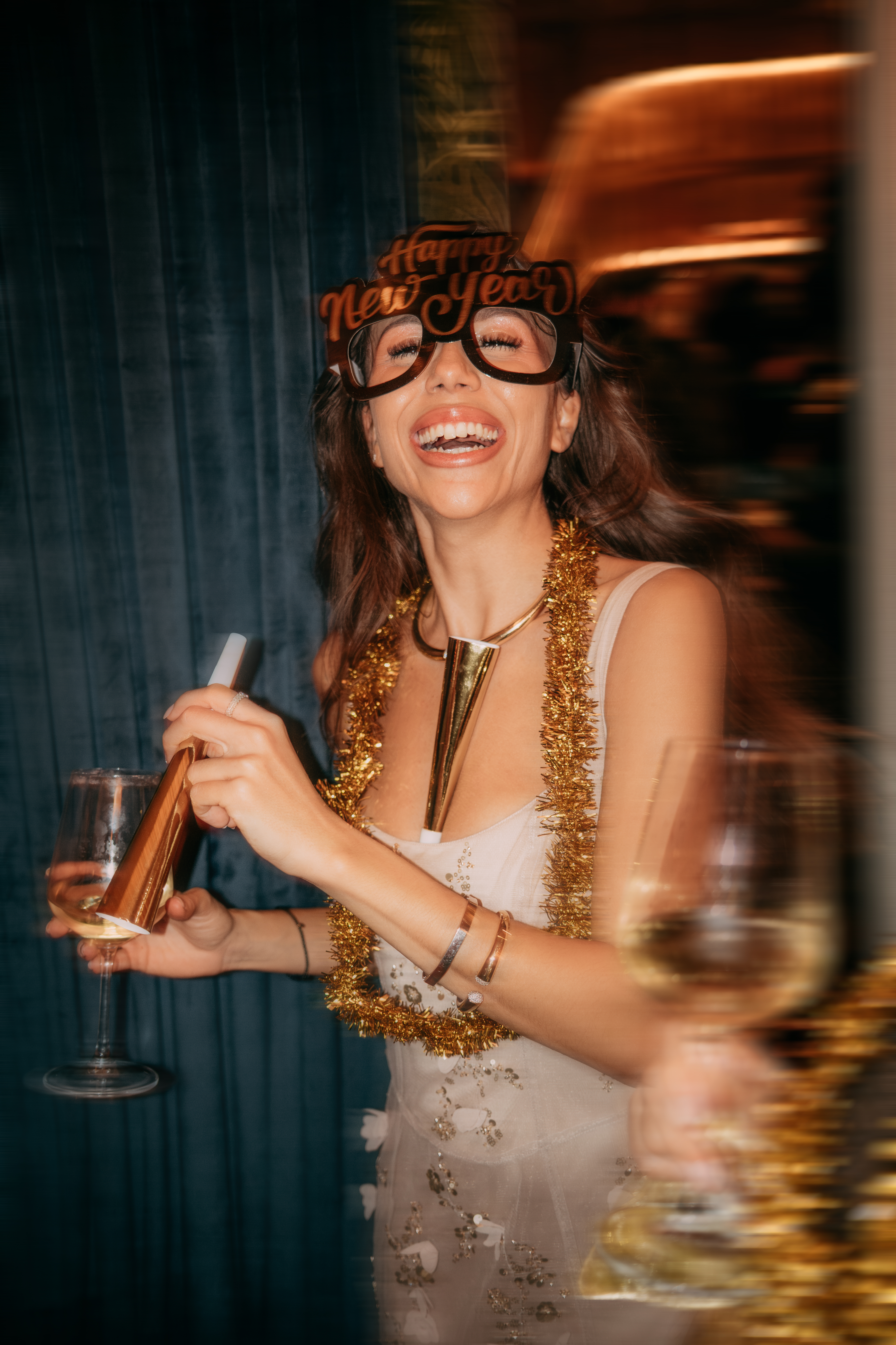 A guest raising a glass at a Casa Ozama celebration